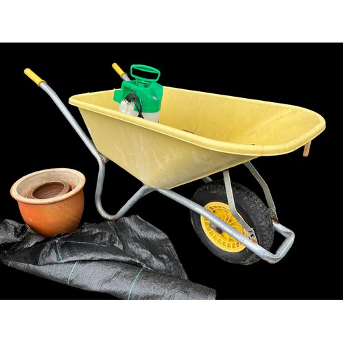 344 - A WHEELBARROW (SLIGHT DAMAGE) AND SOME OTHER GARDENING EQUIPMENT