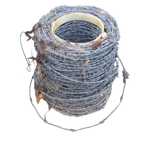 373 - A ROLL OF BARBED WIRE