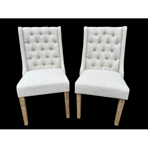 384 - A NEW PAIR OF CREAM  LINEN EFFECT DEEP BUTTON BACK CHAIRS