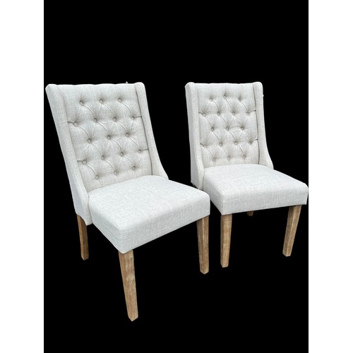 384 - A NEW PAIR OF CREAM  LINEN EFFECT DEEP BUTTON BACK CHAIRS