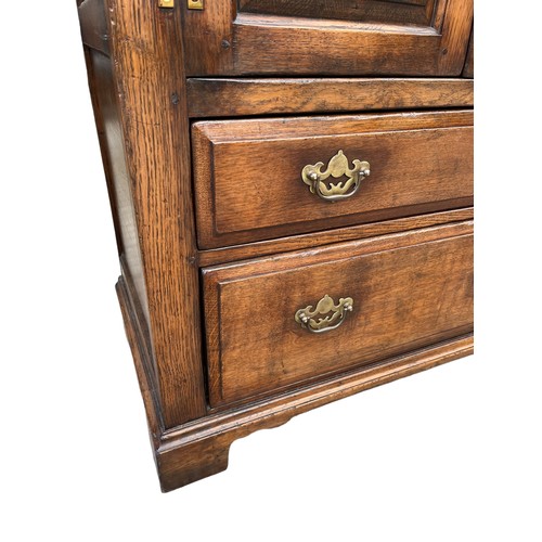 386 - A 2 DRAWERED 2 DOOR OAK COCKTAIL CABINET/TALLBOY 32 x 19 x 40.5