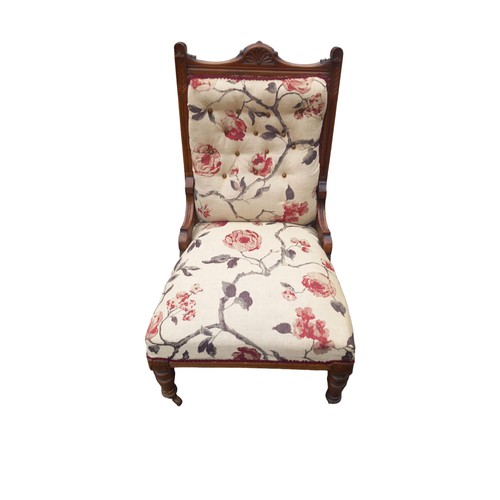 394 - A CARVED ANTIQUE BUTTONED BACK FIRESIDE CHAIR