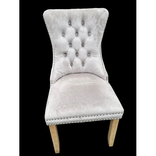 398 - A NEW VELVET BUTTON BACK CHAIR