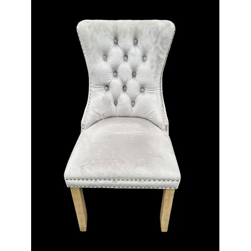 398 - A NEW VELVET BUTTON BACK CHAIR