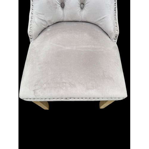 398 - A NEW VELVET BUTTON BACK CHAIR