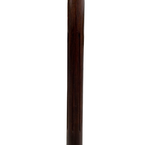 412 - A TALL MAHOGANY TORCJERE ON ORNATE REEDED BASE