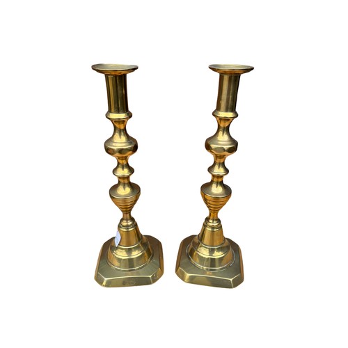 82 - A PAIR OF BRASS CANDLESTICK BY J C LEWIS BIRMINGHAM 11