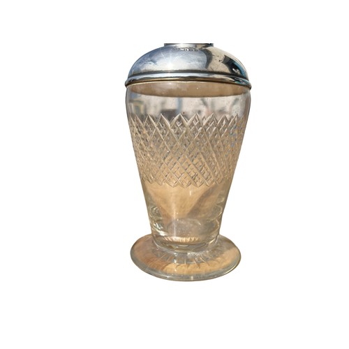 486 - A SILVER TOPPED PERFUME BOTTLE WITH STOPPER **