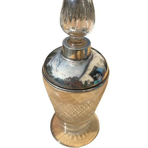 486 - A SILVER TOPPED PERFUME BOTTLE WITH STOPPER **