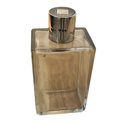 524 - A RECTANGULAR SILVER TOPPED BOTTLE