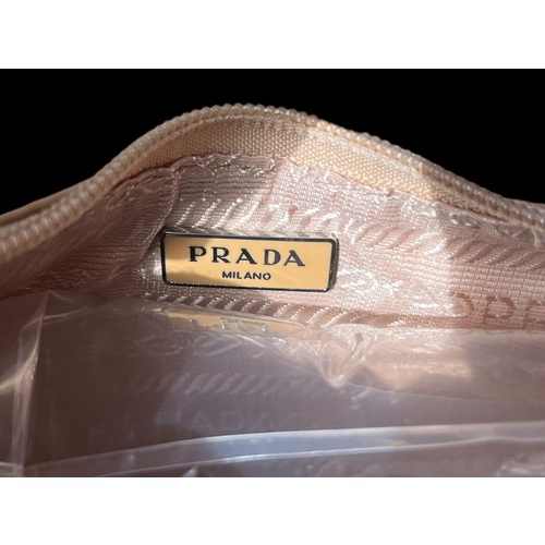 527 - A GENUINE PRADA HANDBAG WITH DUST COVER