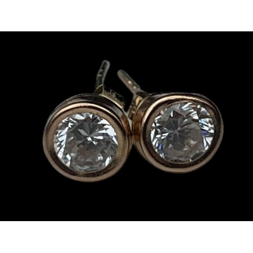 558 - A PAIR OF 9ct GOLD SOLITAIRE EARRINGS