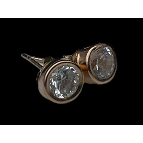 558 - A PAIR OF 9ct GOLD SOLITAIRE EARRINGS