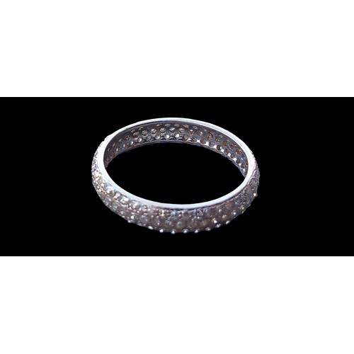 561 - A DIAMOND FULLY SET BAND RING (3.5MM DIA) IN 18ct GOLD  SIZE APPROX 0