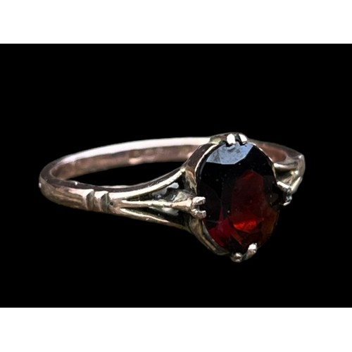 590 - A 9ct GOLD GARNET SET RING