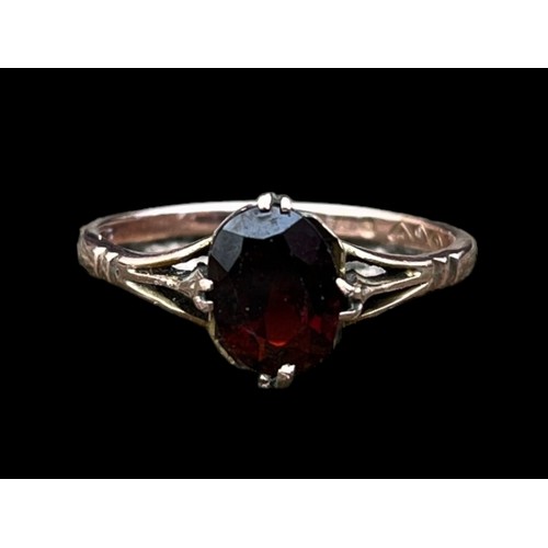 590 - A 9ct GOLD GARNET SET RING