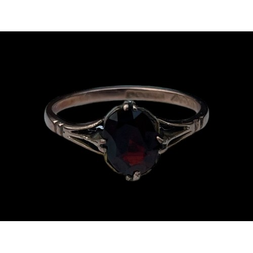 590 - A 9ct GOLD GARNET SET RING