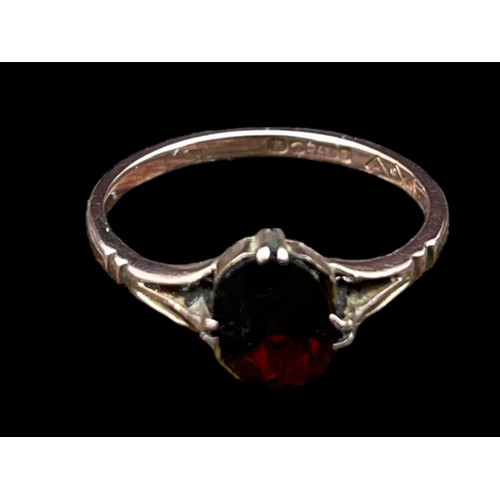 590 - A 9ct GOLD GARNET SET RING