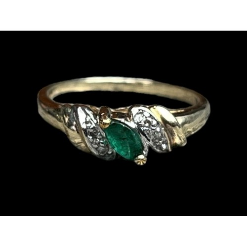 597 - A 14ct GOLD RING WITH EMERALDS AND DIAMOND CHIPS