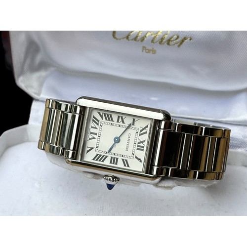 630 - A CARTIER LDS S/S TANK WATCHRECTANGULAR DIAL ,BLACK ROMAN NUMERALS ,CABOUCHON BUTTON ON BRACELET GEN... 