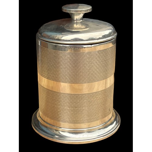 639 - AN ART DECO SILVER CIGARETTE JAR ENGINE TURNED PATTERN