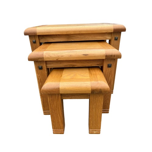 646 - A SOLID OAK NEST OF 3 TABLES **