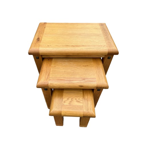 646 - A SOLID OAK NEST OF 3 TABLES **