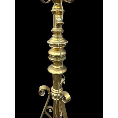 648 - AN ORNATE BRASS TELESCOPIC OIL LAMP WITH DIMPLED RUBY SHADE ** P