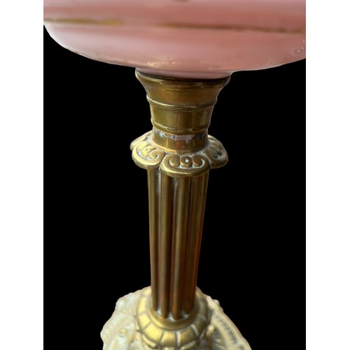 657 - A PINK PORCELAIN HAND PAINTED OIL LAMP BOWL WITH ORNATE BRASS BASE AND NICELY SHAPED SHADE