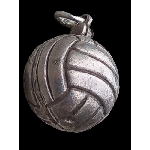 494 - A SILVER LOCKET IN THE FORM OF AN ANTIQUE FOOTBALL