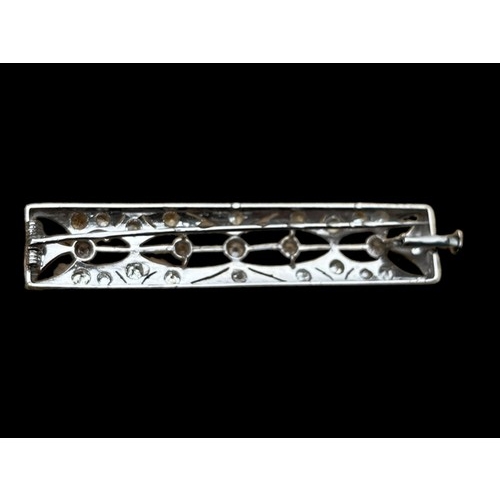 625 - A STUNNING DIAMOND AND PLATINUM SET RECTANGULAR BROOCH OPEN WORK TO CENTRE WITH 5 SEPERATED DIAMONDS... 