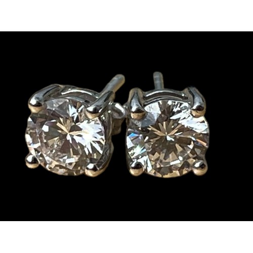 551A - A  PAIR OF LARGE SILVER SOLITAIRE EARRINGS