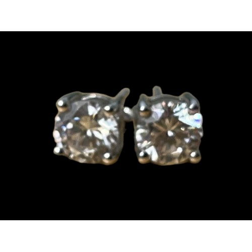 551A - A  PAIR OF LARGE SILVER SOLITAIRE EARRINGS