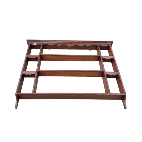 41 - AN ANTIQUE OAK WALL RACK