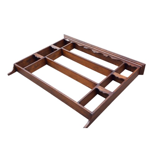 41 - AN ANTIQUE OAK WALL RACK