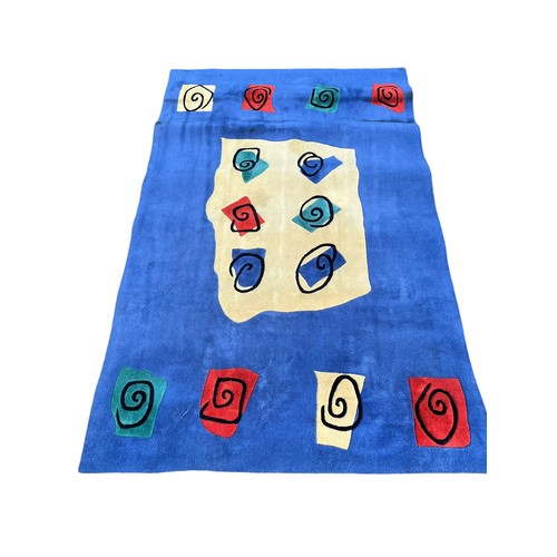 9 - A MULTI COLOURED RUG