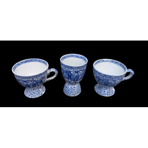 19 - 2 ANTIQUE POTTERY WILLOW PATTERN CUPS AND LARGE EGG CUP