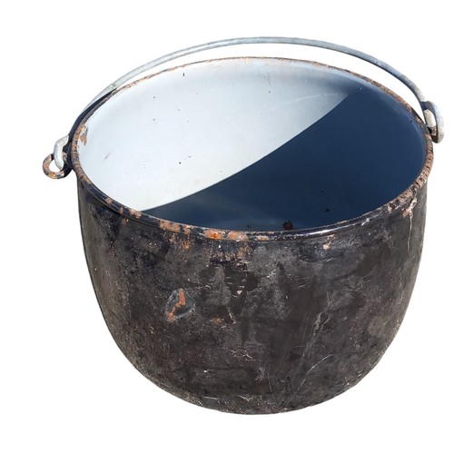 85 - A BLACK ENAMEL ANTIQUE COOKING POT