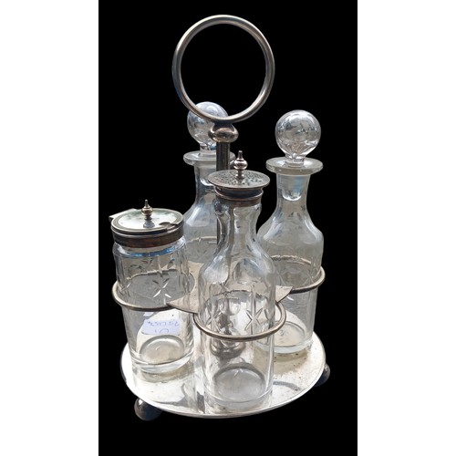 116 - AN ANTIQUE PLATED CRUET SET COMPLETE