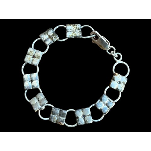 190 - A SILVER MULTI PANEL BRACELET