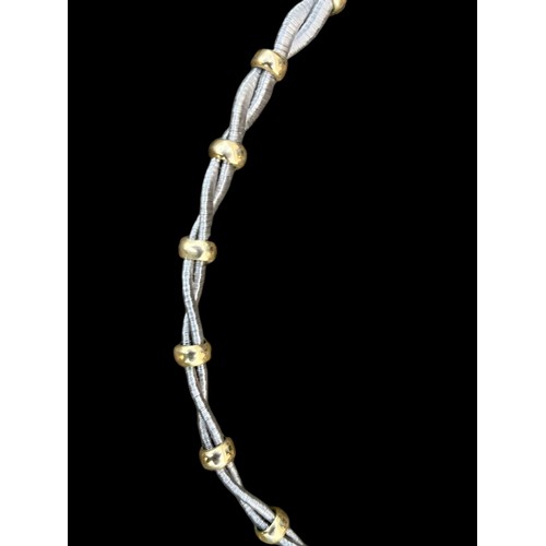 191 - A SILVER TWIST NECKLACE WITH  GOLD COLOURED SPACERS