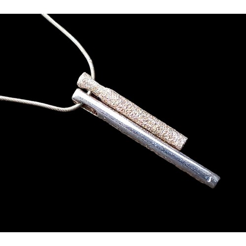 204 - A SILVER BAR PENDANT ON A CHAIN