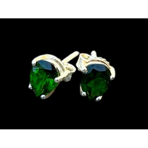 213 - A PAIR OF SILVER EARRINGS SET WITH GREEN STONES