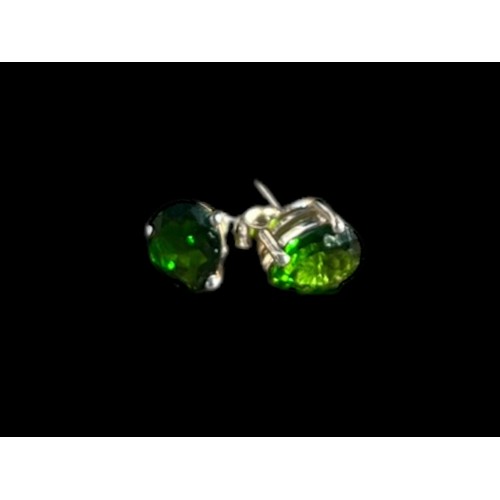 213 - A PAIR OF SILVER EARRINGS SET WITH GREEN STONES