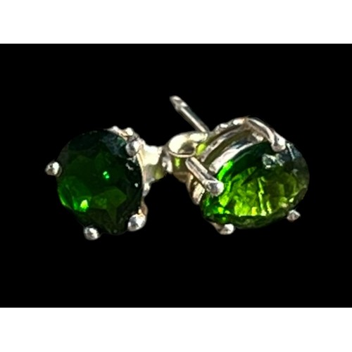 213 - A PAIR OF SILVER EARRINGS SET WITH GREEN STONES