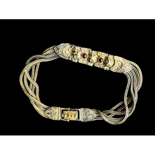 236 - A GOLD PLATED 925 SILVER BRACELET SET WITH RED STONES