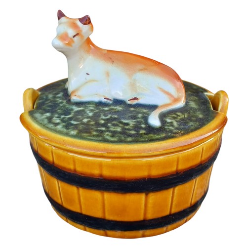 34 - A COW POTTERY BUTTER DISH