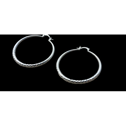 183 - A PAIR OF SILVER BRIGHT CUT HOOP EARRINGS