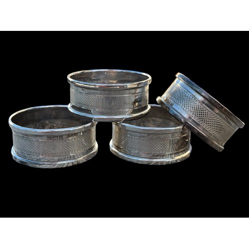 249 - A MATCHING SET OF 4 SILVER NAPKIN RINGS