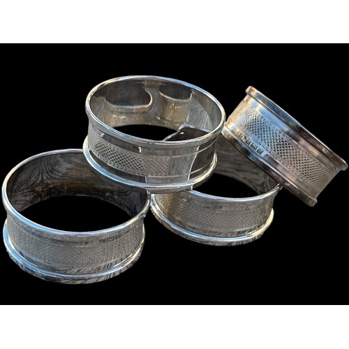 249 - A MATCHING SET OF 4 SILVER NAPKIN RINGS